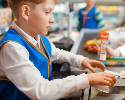 boy-in-uniform-at-the-register-playing-salesman-YXW57GU.jpg